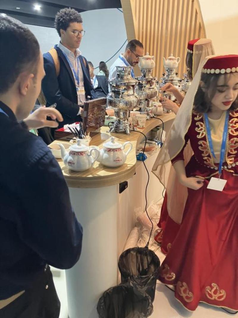 Attendees getting coffee during a break