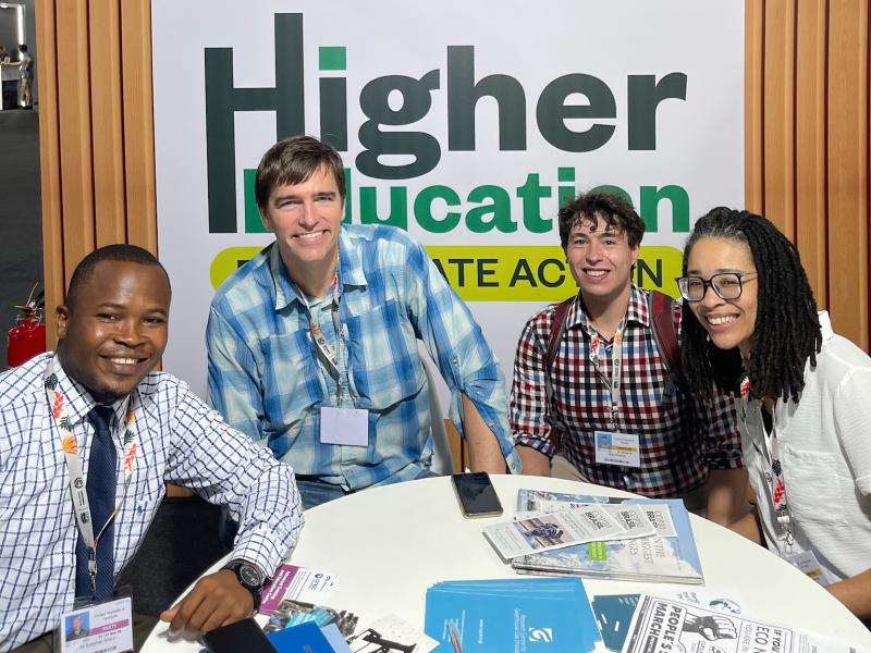 Four people sitting around a table at COP30