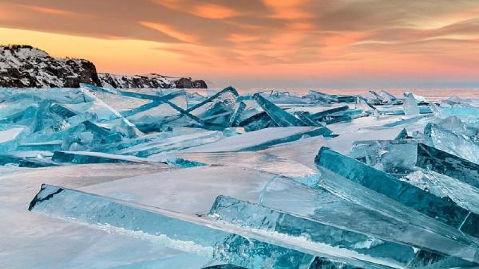 slats of ice and a pink sunset