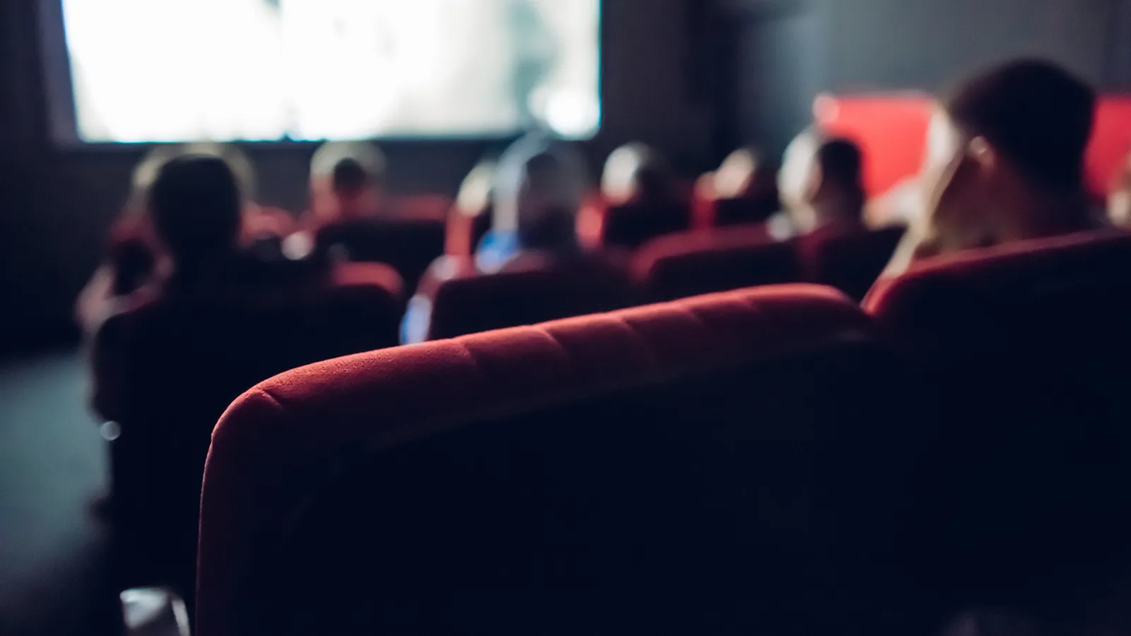Movie theater looking across the audience towards the screen