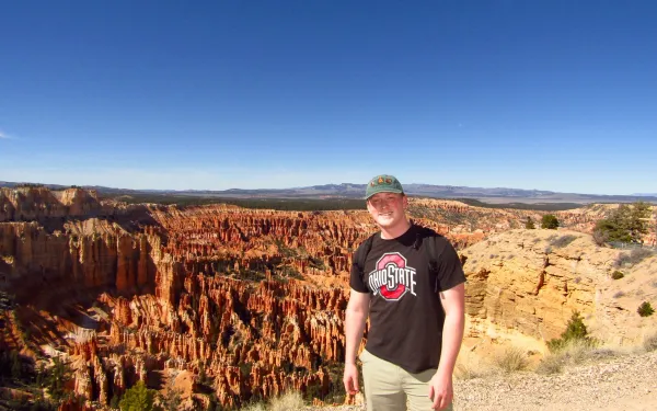 Student standing in front of a canyon in the U.S. Southwest