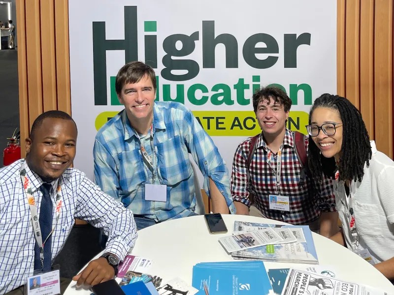 Four people sitting around a table at COP30