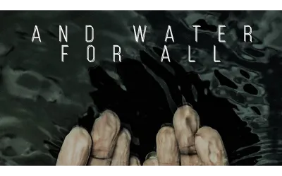 Fingers submerged in rippling water