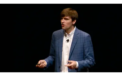 Bart Elmore presenting in front of a black background