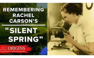 Rachel Carson looking through a microscope