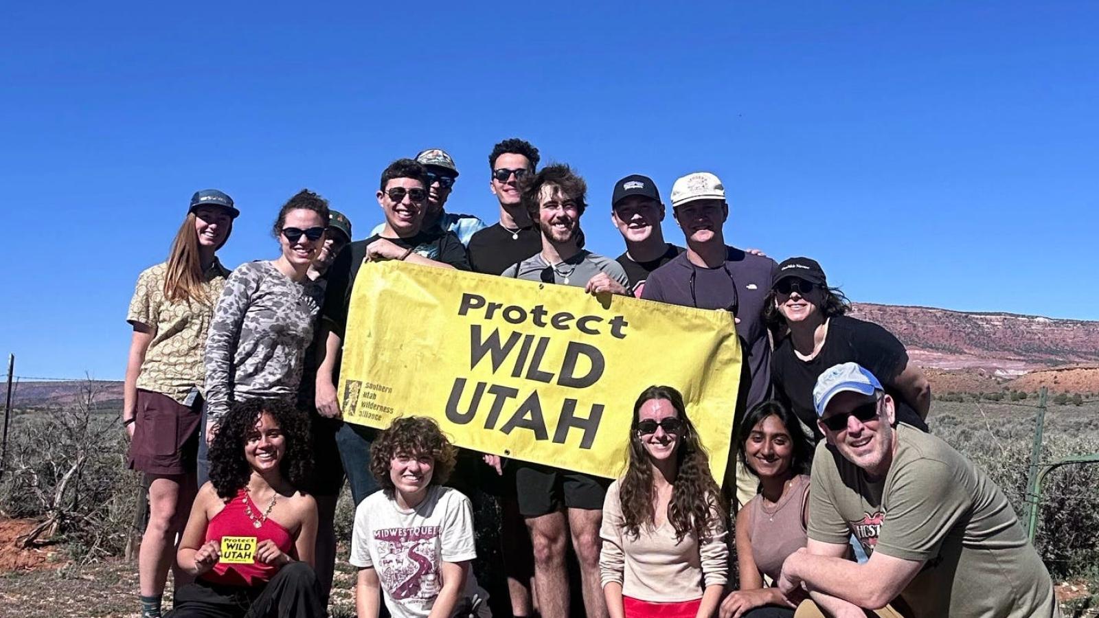 EHI Field School group photo with poster Protect Wild Utah