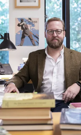Poratrait of John Davis sitting in his office